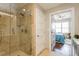 Stylish bathroom featuring a tiled shower and open doorway to the bedroom at 1101 Juniper Ne St # 612, Atlanta, GA 30309