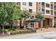 Inviting condo building entrance with covered awning and manicured landscaping at 1101 Juniper Ne St # 612, Atlanta, GA 30309