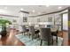 Spacious dining room with large table, hardwood floors, and access to a lounge area at 1101 Juniper Ne St # 612, Atlanta, GA 30309