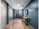 Contemporary hallway with wood floors, blue accent wall and city views at 1101 Juniper Ne St # 612, Atlanta, GA 30309