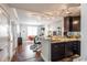 Modern kitchen featuring dark wood cabinets, granite countertops, and stainless steel appliances at 1101 Juniper Ne St # 612, Atlanta, GA 30309