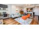 A cozy open concept living area with a dining area, hardwood floors, and modern furnishings at 1101 Juniper Ne St # 612, Atlanta, GA 30309