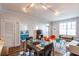 Open-concept living space with dining table, modern lighting, and partial view of the bedroom at 1101 Juniper Ne St # 612, Atlanta, GA 30309
