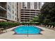 Outdoor community pool with lounge chairs and nearby green space at 1101 Juniper Ne St # 612, Atlanta, GA 30309