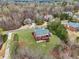 Aerial view of the home with a large lawn and garden at 2220 Stirling Bridge Rd, Cumming, GA 30041