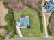 Aerial view of the home with an expansive green lawn and long driveways at 2220 Stirling Bridge Rd, Cumming, GA 30041