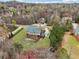 Aerial view of the home with an expansive green lawn and garden at 2220 Stirling Bridge Rd, Cumming, GA 30041
