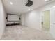 Finished basement with a home theater setup and access to another room at 2220 Stirling Bridge Rd, Cumming, GA 30041