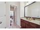 Bathroom featuring a dark wood vanity, granite countertop, and tile floors at 2220 Stirling Bridge Rd, Cumming, GA 30041