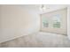 Bright bedroom with two windows and a ceiling fan, providing natural light and air circulation at 2220 Stirling Bridge Rd, Cumming, GA 30041