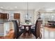 Sunlit dining area featuring hardwood floors, views to the kitchen and backyard at 2220 Stirling Bridge Rd, Cumming, GA 30041