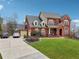 Spacious two-story brick home with a large driveway and well-kept lawn and landscaping at 2220 Stirling Bridge Rd, Cumming, GA 30041