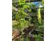 Image of a thriving garden with various plants and a rustic wooden structure at 2220 Stirling Bridge Rd, Cumming, GA 30041