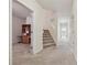 Bright hallway with a staircase, connecting different areas of the home at 2220 Stirling Bridge Rd, Cumming, GA 30041