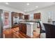 Well-appointed kitchen with stainless steel appliances, granite countertops, and wood cabinetry at 2220 Stirling Bridge Rd, Cumming, GA 30041