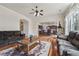 Open concept living room showcases hardwood floors and provides seamless access to the kitchen at 2220 Stirling Bridge Rd, Cumming, GA 30041