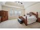 Serene main bedroom featuring triple windows for lots of natural light at 2220 Stirling Bridge Rd, Cumming, GA 30041