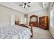Spacious main bedroom featuring tray ceilings, bright natural light, and lots of storage at 2220 Stirling Bridge Rd, Cumming, GA 30041