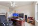 Dedicated office space with a desk, computer setup, and ample storage, perfect for remote work at 2220 Stirling Bridge Rd, Cumming, GA 30041