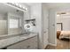 Bright bathroom with double vanity, granite countertop, and separate tub at 4419 White Rd, Douglasville, GA 30135