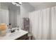 Clean bathroom featuring a single vanity, neutral color scheme, and shower with curtain at 4419 White Rd, Douglasville, GA 30135