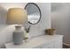 Elegant entryway with decorative lamp, mirror, and stylish console table at 4419 White Rd, Douglasville, GA 30135