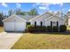 Charming one-story home with a two-car garage and well-maintained front yard at 4419 White Rd, Douglasville, GA 30135