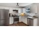 Functional kitchen with stainless steel appliances, granite counters, and plentiful storage space at 4419 White Rd, Douglasville, GA 30135