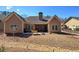 Expansive backyard with patio area, fire pit, and plenty of room for outdoor entertaining at 115 Dorys Way, Dallas, GA 30157