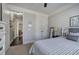 Cozy bedroom with a comfortable bed, natural lighting, and a ceiling fan at 115 Dorys Way, Dallas, GA 30157
