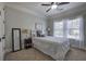 Comfortable bedroom with natural light and neutral carpeting and paint at 115 Dorys Way, Dallas, GA 30157