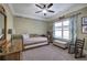 Nicely appointed bedroom featuring soft lighting, natural light, and a ceiling fan at 115 Dorys Way, Dallas, GA 30157