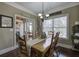 Dining room with hardwood floors, chandelier, and views to the outdoor porch at 115 Dorys Way, Dallas, GA 30157
