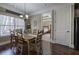 Dining room with hardwood floors and natural light is conveniently located next to the kitchen at 115 Dorys Way, Dallas, GA 30157