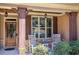 Close-up of a welcoming front porch with rocking chairs and decorative details at 115 Dorys Way, Dallas, GA 30157