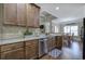 Eat-in kitchen features stainless appliances, granite counters, tile backsplash, and hardwood floors at 115 Dorys Way, Dallas, GA 30157