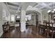 Spacious living and dining area with hardwood floors, coffered ceilings, and great natural light at 115 Dorys Way, Dallas, GA 30157
