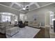 Spacious living room featuring hardwood floors, a ceiling fan, and comfortable seating at 115 Dorys Way, Dallas, GA 30157