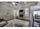 An open concept living room with a decorative fireplace and modern decor at 115 Dorys Way, Dallas, GA 30157