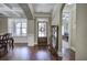 Open floor plan with hardwood floors, coffered ceiling, and a view into the office at 115 Dorys Way, Dallas, GA 30157