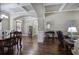 Open-concept living space showcasing hardwood floors and coffered ceilings at 115 Dorys Way, Dallas, GA 30157