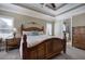 Spacious main bedroom with trey ceiling, sitting area and large windows with access to the ensuite bathroom at 115 Dorys Way, Dallas, GA 30157