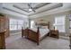 Spacious main bedroom features a trey ceiling, carpeted floors, and abundant natural light at 115 Dorys Way, Dallas, GA 30157