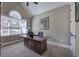 Well-lit office with a large desk, vaulted ceiling, and neutral carpeting at 115 Dorys Way, Dallas, GA 30157