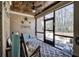 Relaxing screened-in porch with a ceiling fan, outdoor seating, and views of the backyard at 115 Dorys Way, Dallas, GA 30157