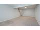View of a spacious finished basement that includes carpet flooring and staircase at 1196 Yellow River Dr, Lawrenceville, GA 30043