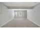 This spacious finished basement features carpet flooring and natural light from windows at 1196 Yellow River Dr, Lawrenceville, GA 30043
