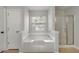 Relaxing bathroom with soaking tub and separate glass enclosed shower at 1196 Yellow River Dr, Lawrenceville, GA 30043