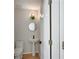 Charming powder room with pedestal sink and modern fixtures at 1196 Yellow River Dr, Lawrenceville, GA 30043
