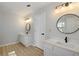 Bathroom featuring double sinks, modern lighting and light colored countertops at 1196 Yellow River Dr, Lawrenceville, GA 30043